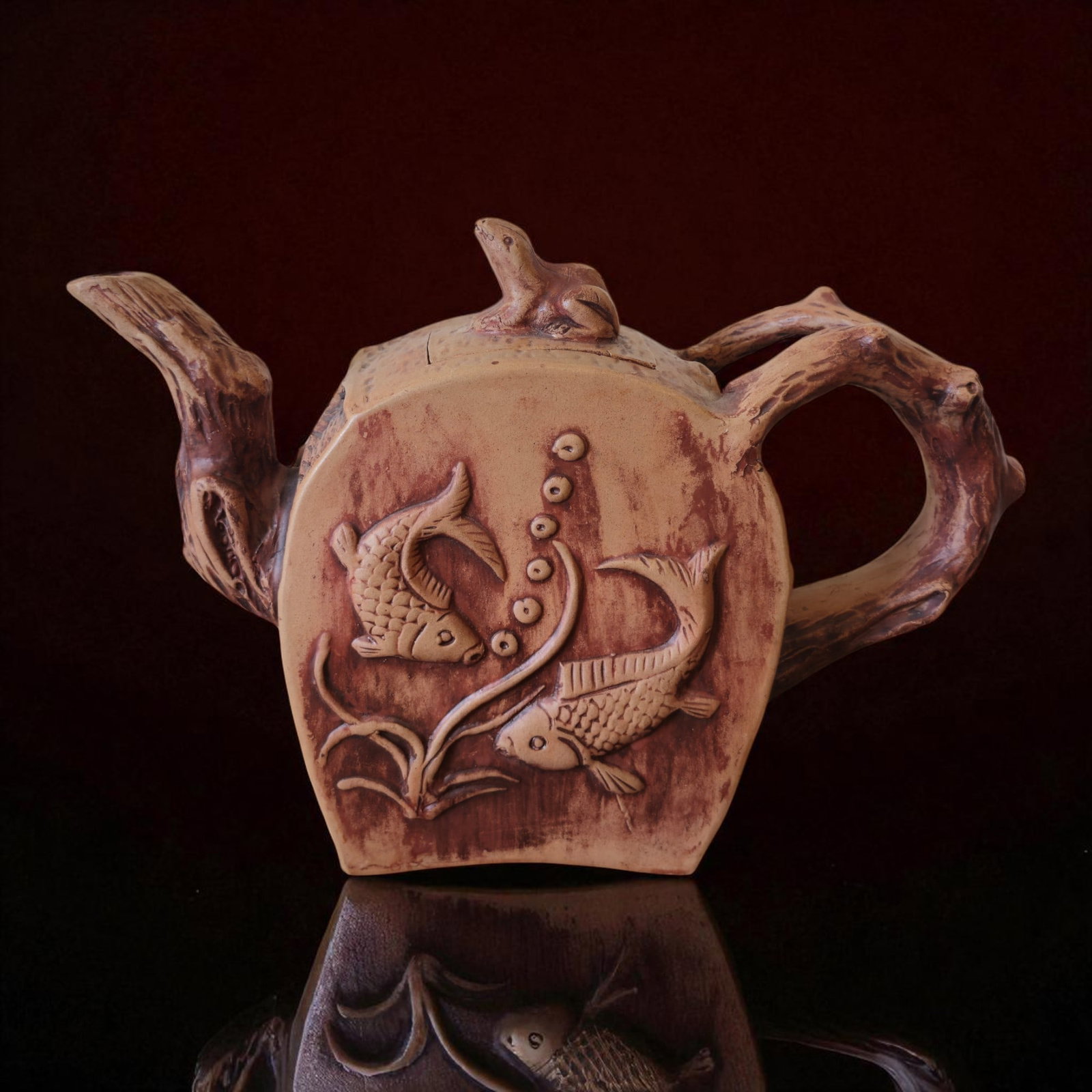 Large Chinese Yixing Stoneware Teapot with Frog Finial, Qing Dynasty: This substantial Chinese Yixing stoneware teapot, weighing 1711 grams and measuring 33 cm in width and 23.5 cm in height (18.5 cm without lid), exemplifies the artistry and sculptural creativity of Qi