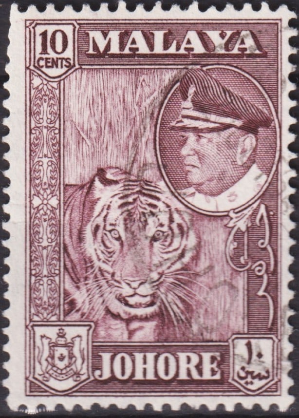 1960 Johore 10c Sultan Ismail & Tiger Dark Carmine Brown Scott 163 MY-JO#148: Issued on June 10, 1960, and listed as Scott 163 / Michel MY-JO 148, this engraved definitive from Johore (Malaya) depicts Sultan Ismail ibn Sultan Ibrahim alongside a Malayan tiger (Panthera tigris) 