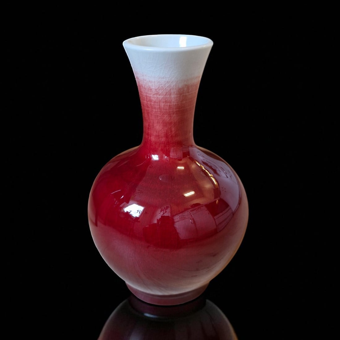 Chinese Flambé Glazed Porcelain Vase, Republic Period, c. 20th Century: This finely potted porcelain vase, dating to the mid-20th century, exemplifies the enduring fascination with flambé glazes that originated in the Qing dynasty and continued into the Republic period. 