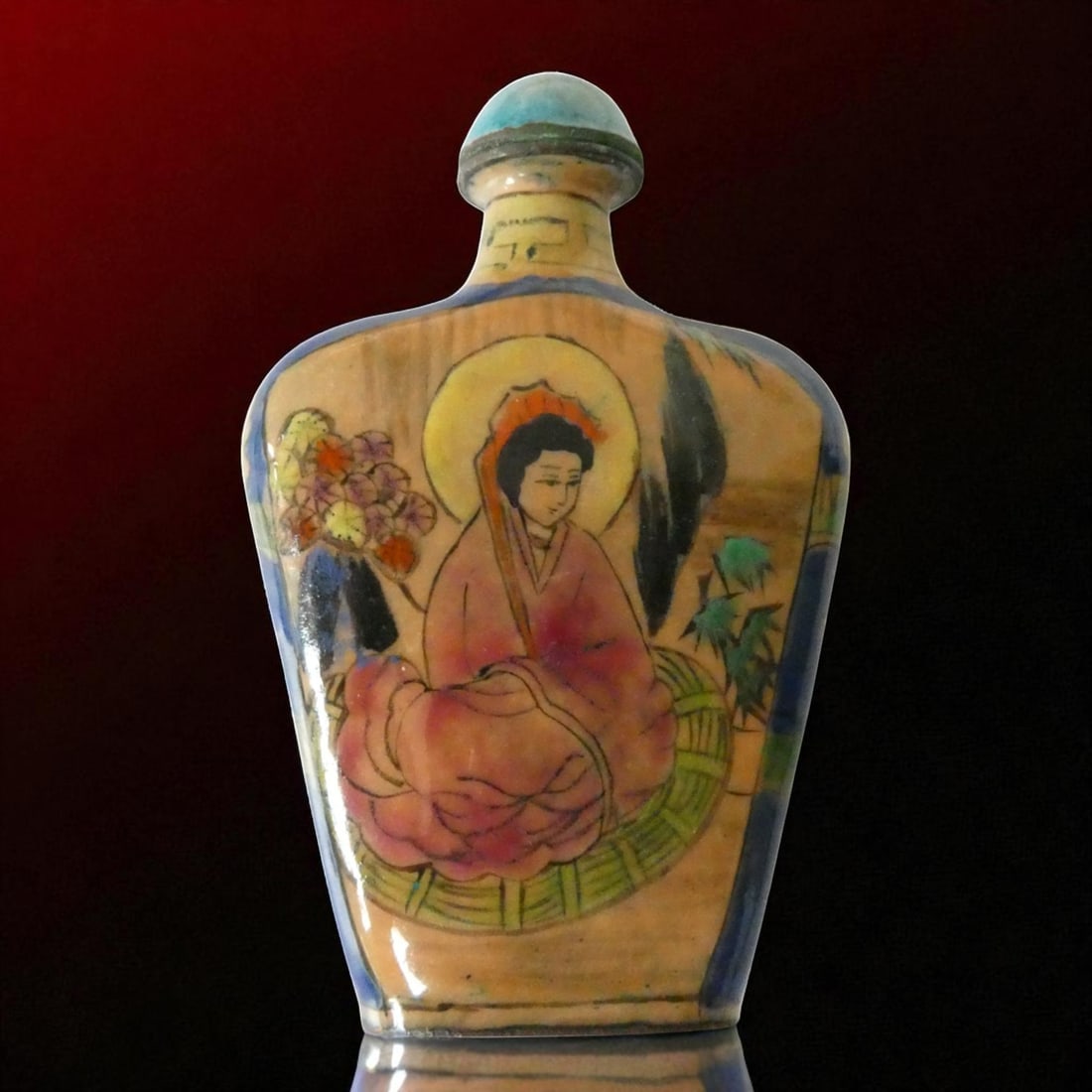 Hand-Painted Chinese Wooden Snuff Bottle with Buddhist Motif, ca. 20th Century: This distinctive Chinese snuff bottle, dating from the mid-20th century, is an uncommon example crafted in hand-painted lacquered wood rather than the more typical porcelain, glass, or stone. Measurin