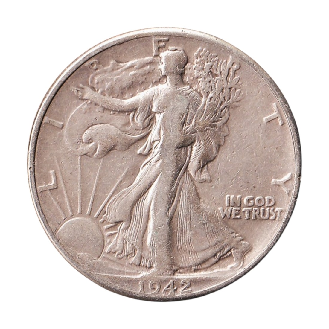 1942 USA Walking Liberty Half Dollar KM 142 90% Silver: Issued in 1942, this original United States Walking Liberty Half Dollar 50 Cents was struck at the Philadelphia Mint and is catalogued as KM 142 and Colnect US-000075. Struck in 90% silver and 10% cop