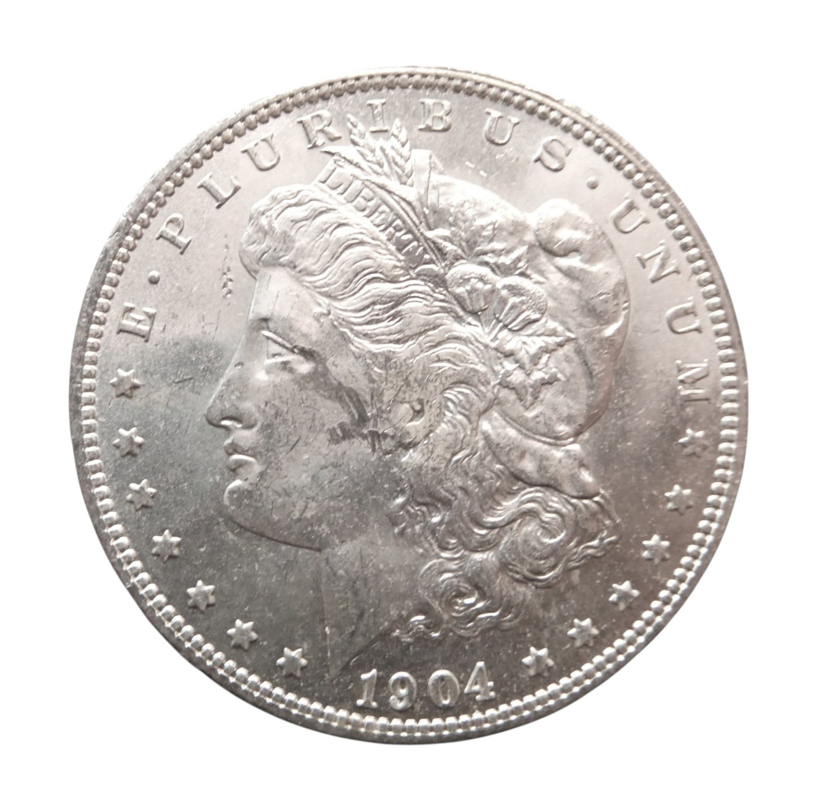 1904-O Morgan Silver Dollar, New Orleans Mint, KM#110, VF Condition: This 1904-O Morgan Silver Dollar, minted at the historic New Orleans Mint, represents one of the final years of Morgan dollar production prior to its long hiatus after 1904. With a mintage of 3,720,00