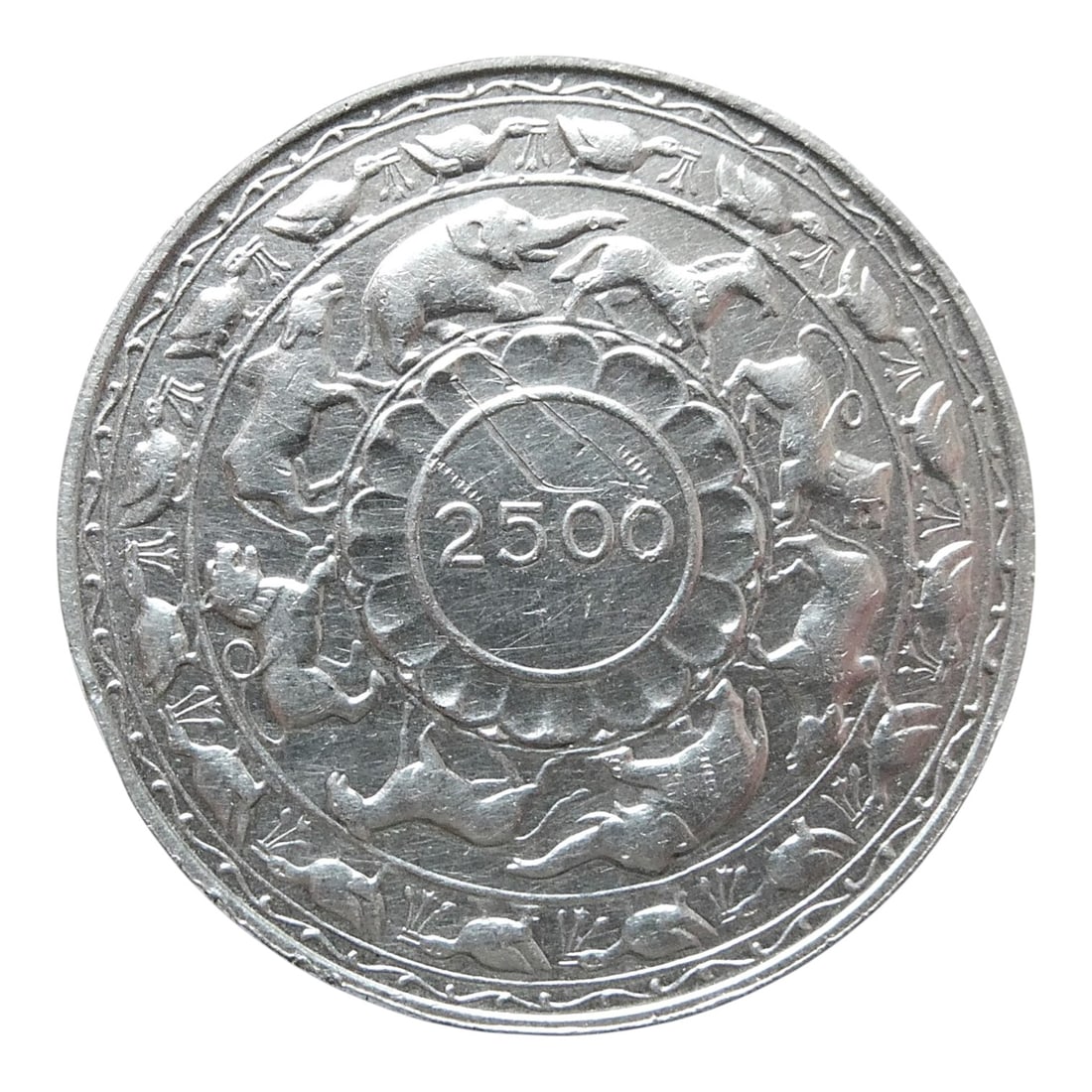 1957 Ceylon (Sri Lanka) 5 Rupees Silver Coin, 2500th Anniversary of Buddhism: Issued in 1957 under the reign of Queen Elizabeth II, this 5 Rupees silver coin from Ceylon (now Sri Lanka) commemorates the 2500th anniversary of the advent of Buddhism. Struck in .925 fine silver, t