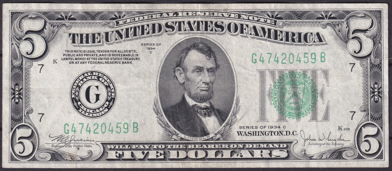USA 1934-C $5 Federal Reserve Note – Chicago – Fr. 1958-G – Serial G47420459B – Abraham: Issued as part of the Series of 1934-C, this classic $5 Federal Reserve Note was issued through the Federal Reserve Bank of Chicago, District G (7) and bears serial number G47420459B. The obverse feat