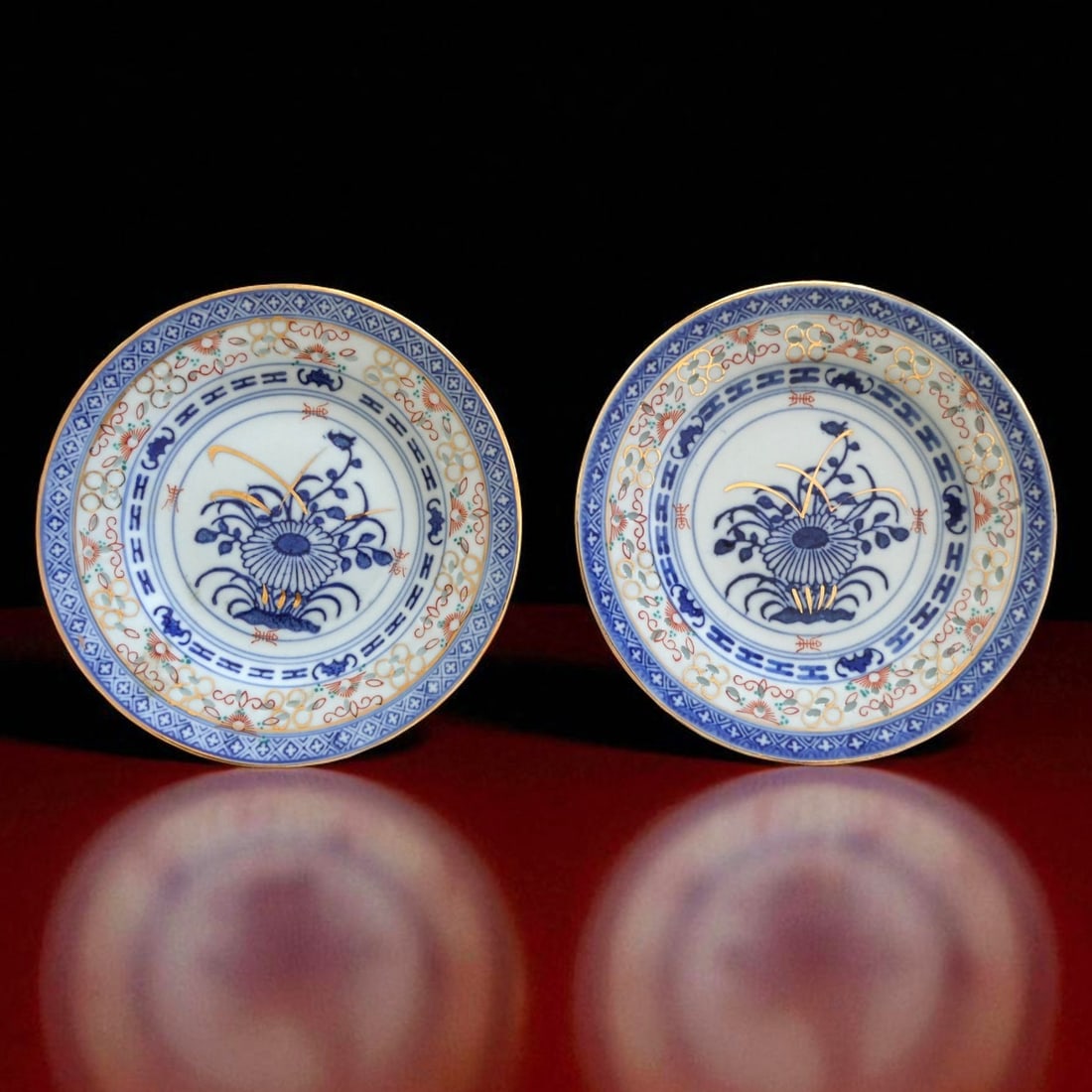 Pair of Japanese Imari Style Porcelain Plates, Showa Period, 20th Century: This pair of Japanese porcelain plates, dating to the Showa period of the 20th century, represents the enduring tradition of Imari-style decoration with a refined and balanced execution. Each plate me