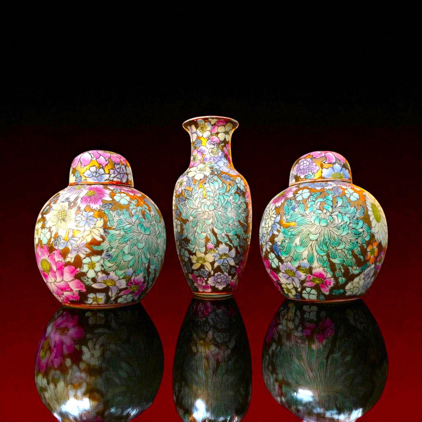 Set of Three Famille Rose Floral Porcelain Vases with Covers, Republic Period: A refined set of three hand-painted porcelain vessels, comprising two lidded baluster jars measuring 15.5 cm in height and weighing approximately 528 g each, together with a slender vase of 21 cm heig