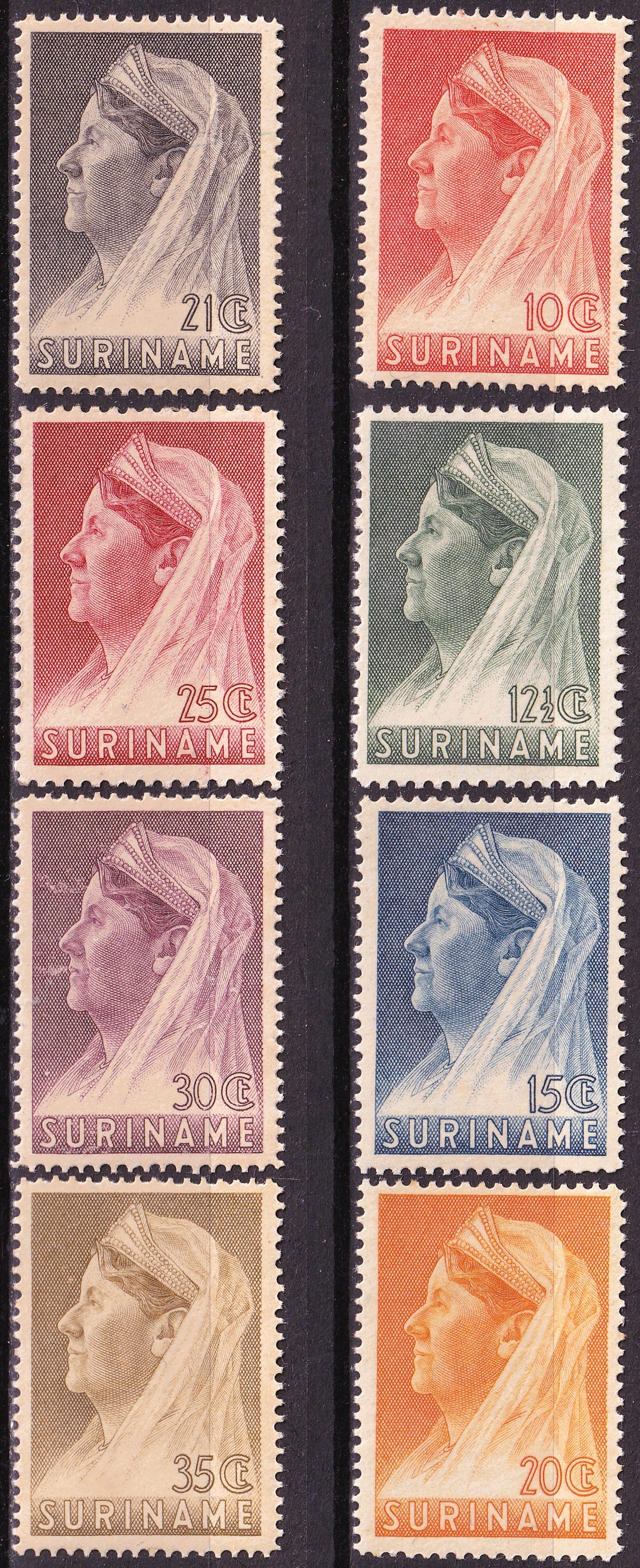 Suriname 1936-1939 Queen Wilhelmina Veil 8-Stamp MNH Set Michel 187A-194C: An attractive mint never hinged group of eight Queen Wilhelmina definitive stamps issued for Suriname during the Dutch colonial period, spanning the 1936-1939 printings and perforation varieties of th