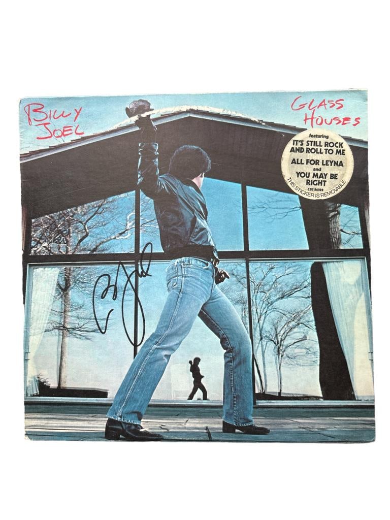 Billy Joel Signed Glass Houses Vinyl LP Photo Proof ACOA: This lot is a vinyl LP 'Glass Houses' autographed on the front in black sharpie pen by Billy Joel. Item comes with exact photo proof of Billy signing the vinyl along with third-party authentication fr