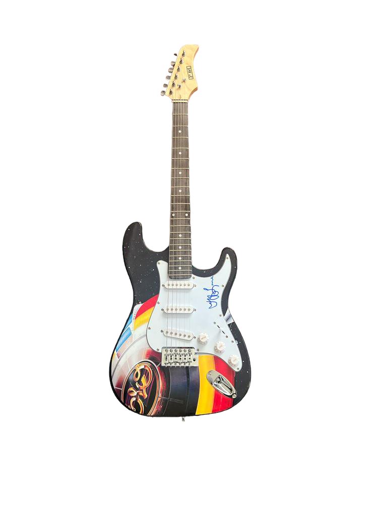 Jeff Lynne ELO Signed Electric Guitar ACOA Photo Proof: This lot is an electric stratocaster style guitar, autographed by Jeff Lynne of ELO. Item comes with photo proof from exact time of signing as well as third-party authentication from ACOA. Jeffrey Lyn
