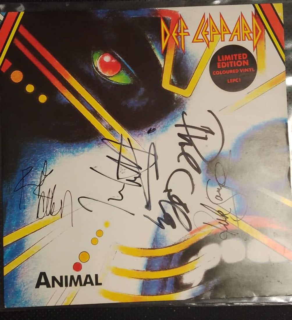 Def Leppard Signed 'Animal' Red 12" Vinyl: This lot is a red 12" vinyl (Animal) autographed on the front cover by Joe Elliot, Phil Collen, Rick Savage and Rick Allen of Def Leppard. Item is guaranteed to pass third-party authentication. As one