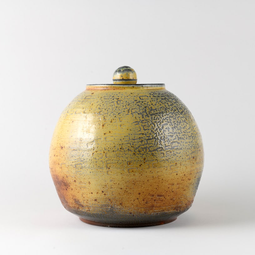 Sharif Bey 'Jar with Textured Surface': This commanding vessel brings the visual language of acclaimed Pittsburgh-born artist Sharif Bey into a richly textured, architectural form. Its rounded silhouette is covered with repeated geometric