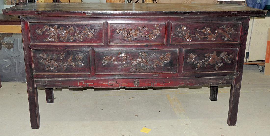 Chinese Carved Lacquer Sideboard Cabinet: A Chinese carved lacquer sideboard cabinet with a carved solid front and drawers on the side with an open case underneath. 39-1/2 in tall x 79-1/2 in wide x 23-1/2 in deep.