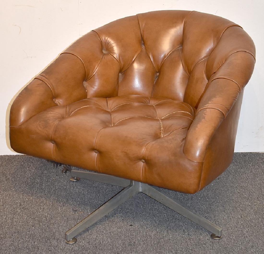 Ward Bennett Swivel Lounge Chair: A Ward Bennett brown leather lounge chair on an angular chrome swivel base. Unmarked. 28 in tall x 30 in wide x 30 in deep. Provenance: From the collection of Paul Shaub, New Castle DE.