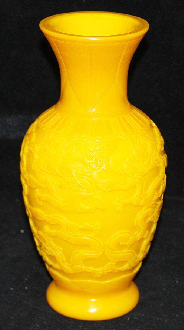 Peking Glass Vase with Dragons: A Peking yellow glass vase with carved dragons and seal mark on base. 10-1/2 in tall.