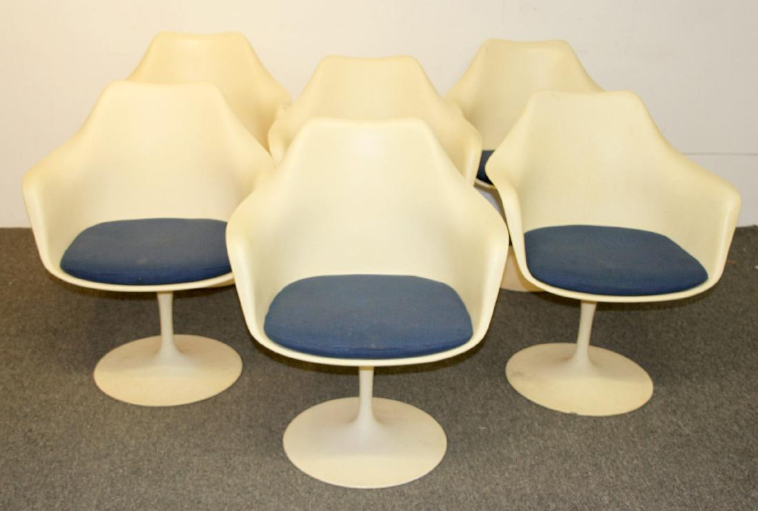 Six Eero Saarinen/Knoll Tulip Armchairs: A set of six Eero Saarinen for Knoll "Tulip" armchairs with blue upholstered slip cushions. Each labeled. 32H x 25W x 23D in.