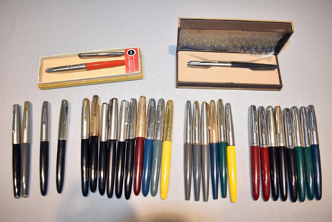 30 Parker Fountain Pens: One with marked gold nib. Lot to include: Parker "45" in original box, with cartridge, red barrel, silver cap, no cartridge in pen. 5-3/8in. capped, in as new condition with minimal to no wear; minima