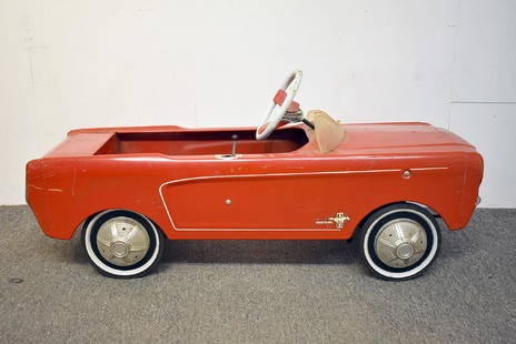 Red Ford Mustang Pedal Car: A red convertible Ford Mustang pedal car. 18 in tall x 39 in long x 14 in wide.