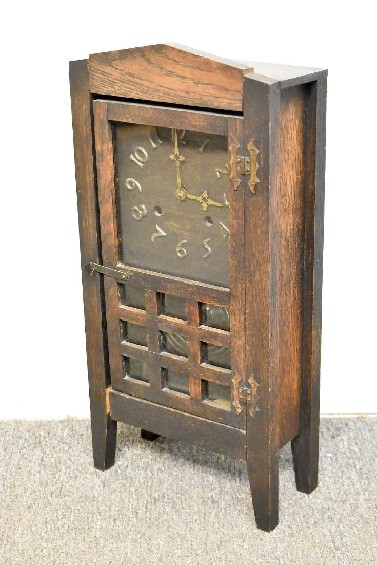 New Haven Arts & Crafts Oak Shelf Clock: A New Haven oak Arts & Crafts shelf clock. 20-1/2 in tall x 9-3/4 in wide x 4-1/2 in deep.