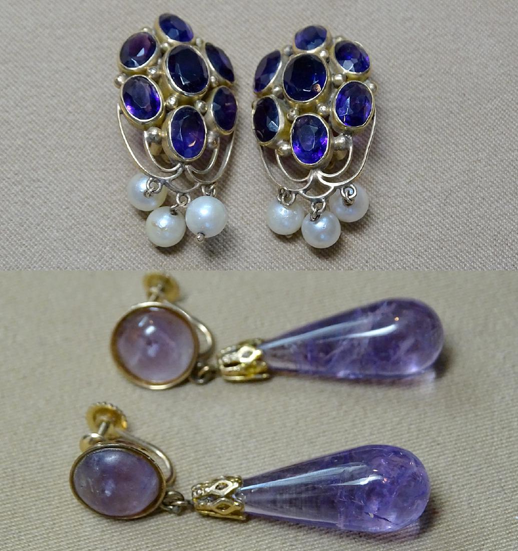 Two Pairs of Amethyst Earrings: A grouping of two pairs of amethyst earrings to include a pair of 14K yellow gold clip-backs each with a cluster of seven oval cut amethysts and three 5mm pearl drops, 7.1dwt together with a pair of 1