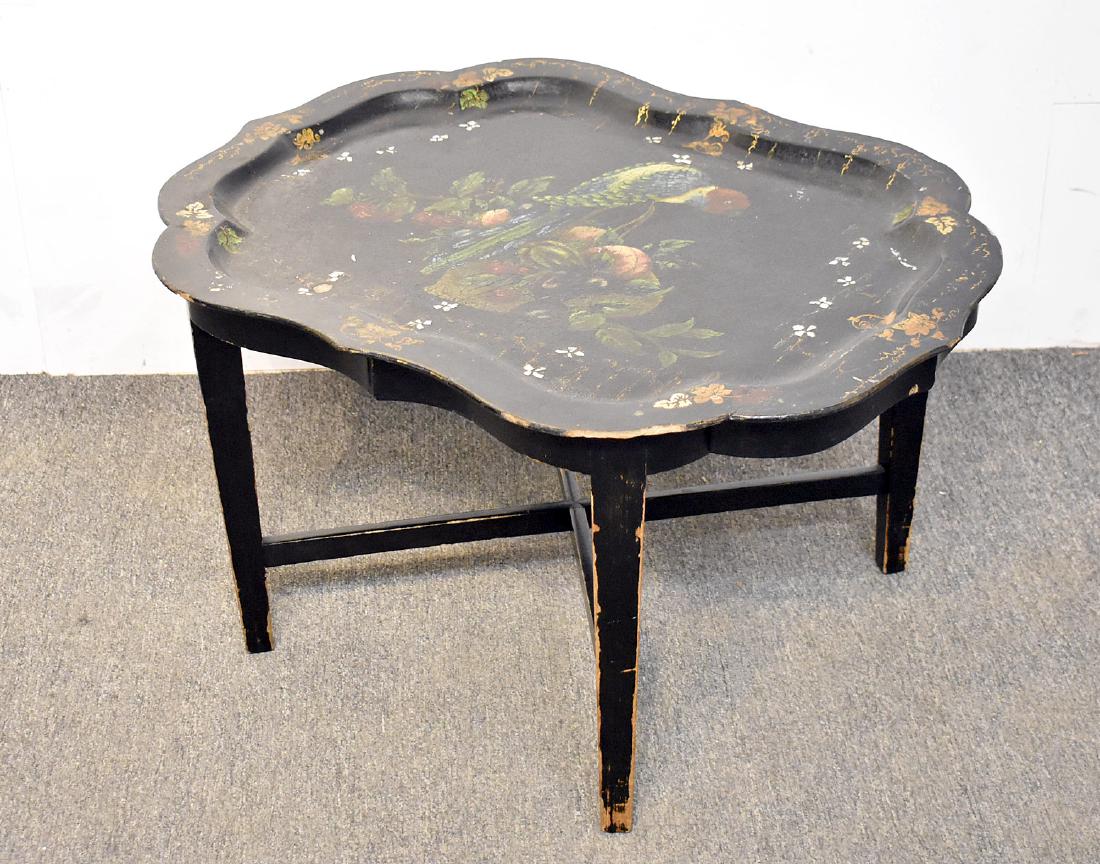 Victorian Paper Mache Tray Table: A Victorian paper-machÃ© tray table with parrots and foliage decoration on ebonized stand. 18in tall x 31-1/2in wide x 24in deep.