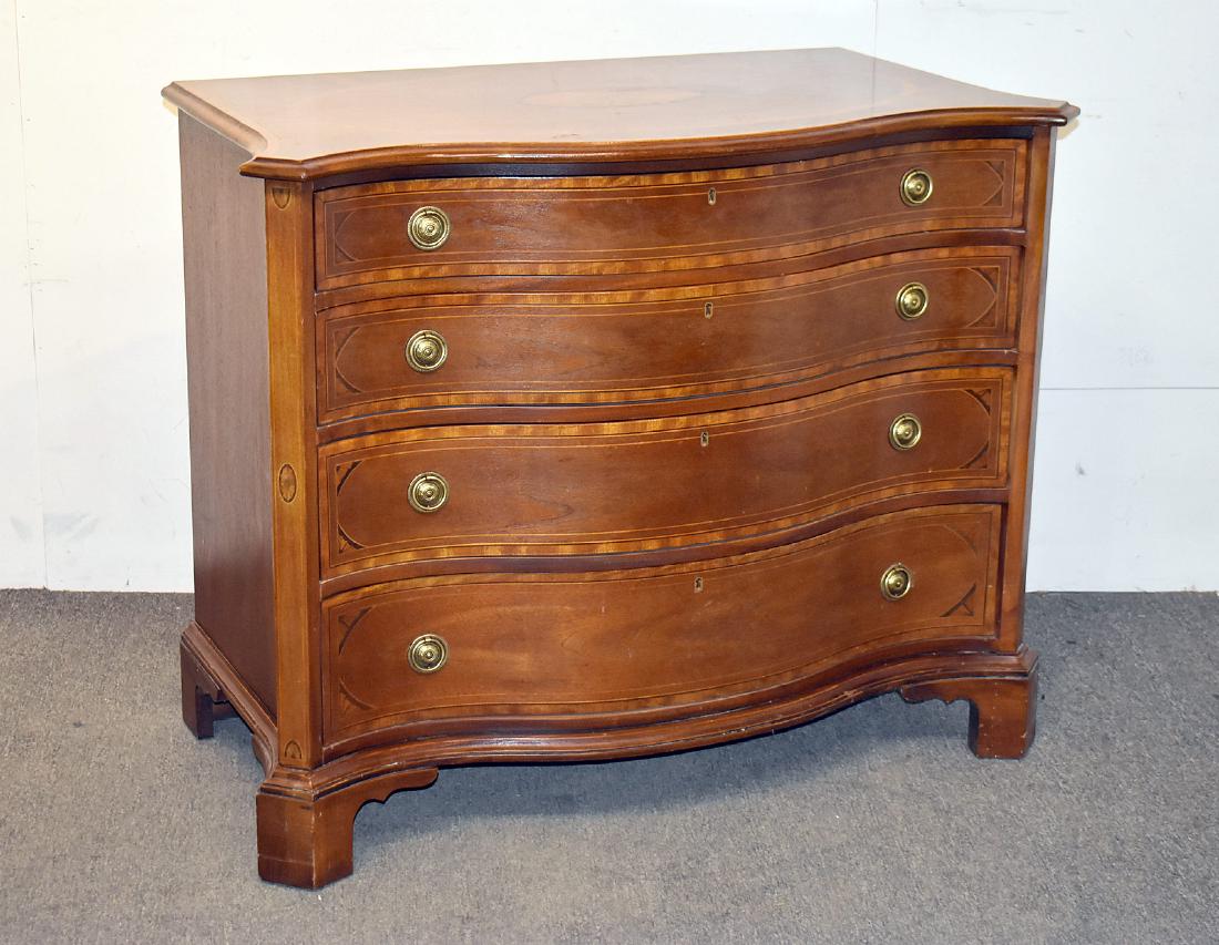 Henredon Natchez Collection Bachelor Chest: A Henredon Natchez Collection banded and inlaid mahogany serpentine bachelor chest with four graduated drawers on bracket feet. 33in tall x 42in wide x 23in deep.