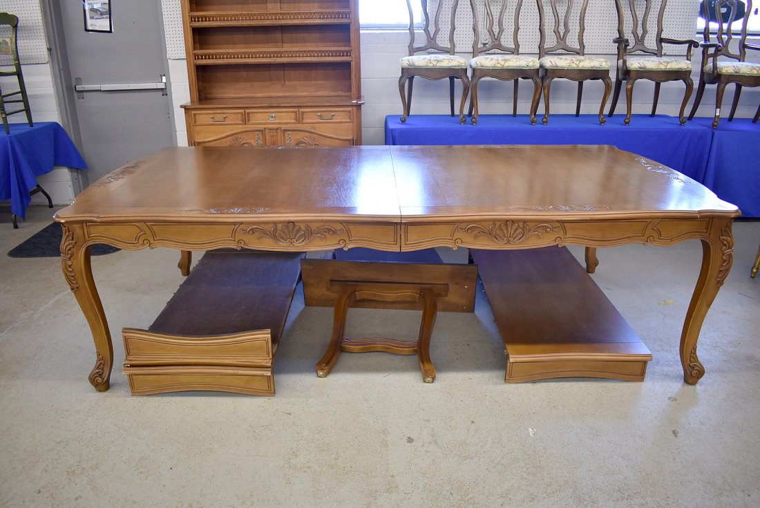 Custom Louis XV-style Extension Dining Table: A large, custom made Louis XV-style extension dining table with a shaped rectangular top over a carved apron on cabriole legs. 31in tall x 104in long x 53in wide. With three 24in wide leaves.