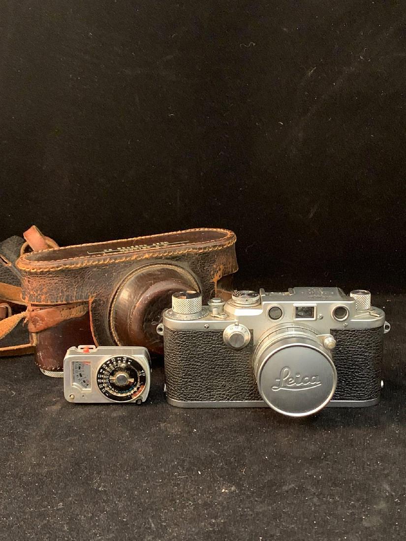 Leica III 35mm Camera: A Leica III 35mm camera, serial #640305, with Ernst Leitz Summaron f=5 cm lens, serial #938449, and with leather case and Sekonic Micro-Clipon light meter.