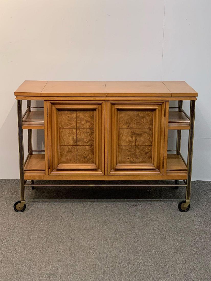 Metz Contempora Bar Cart: A J.L. Metz "Contempora" bar cart with flip-out server top and brass sides on casters. 30in tall x 42in wide x 18in deep.