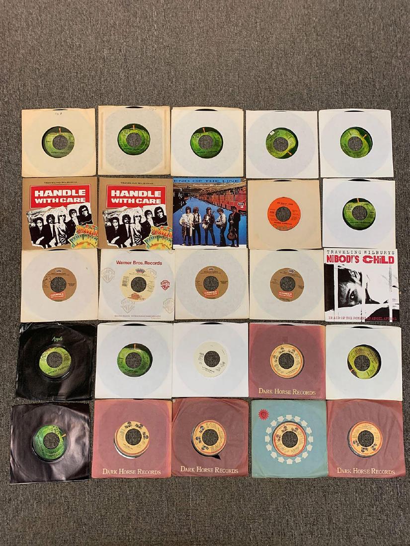 65 Assorted George Harrison-Related 45RPM Records: A grouping of 65 assorted George Harrison-related 45rpm records including The Traveling Wilburys. Also included are picture sleeves, promotionals, and imports.