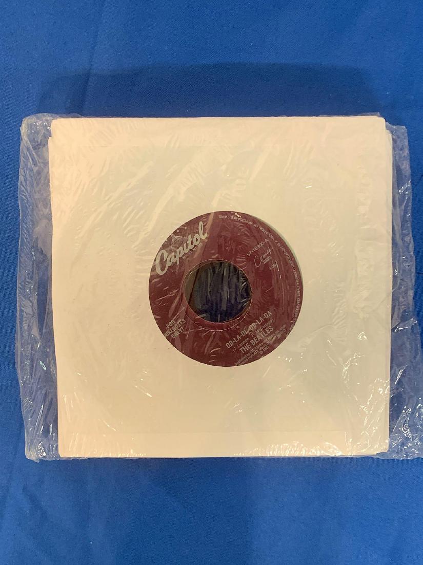Sealed Package of Beatles 45RPM Records: A sealed package of Beatles 45rpm records. All colored vinyl marked "For Jukeboxes Only".