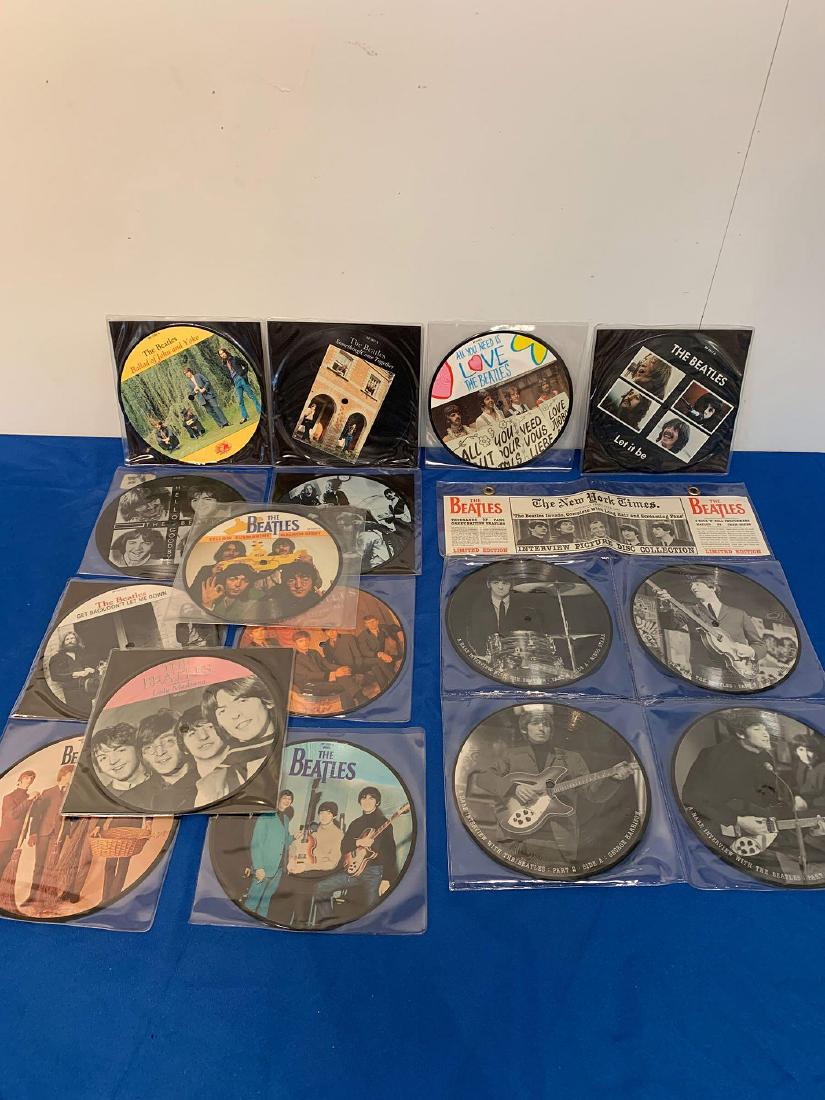 13 Beatles Picture Disc 45RPM Records: A grouping of 13 Beatles picture disc 45rpm records including a four-piece interview set.