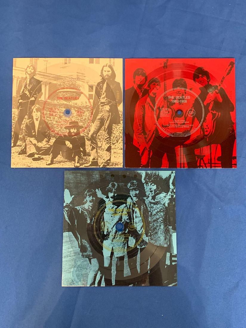 3 Sam Goody Promo Beatles Evatone 45s: A set of 3 Sam Goody promotional Beatles evatone flexidisc extended play 45rpm records. 1962-1966, 1967-1970, and White Album.