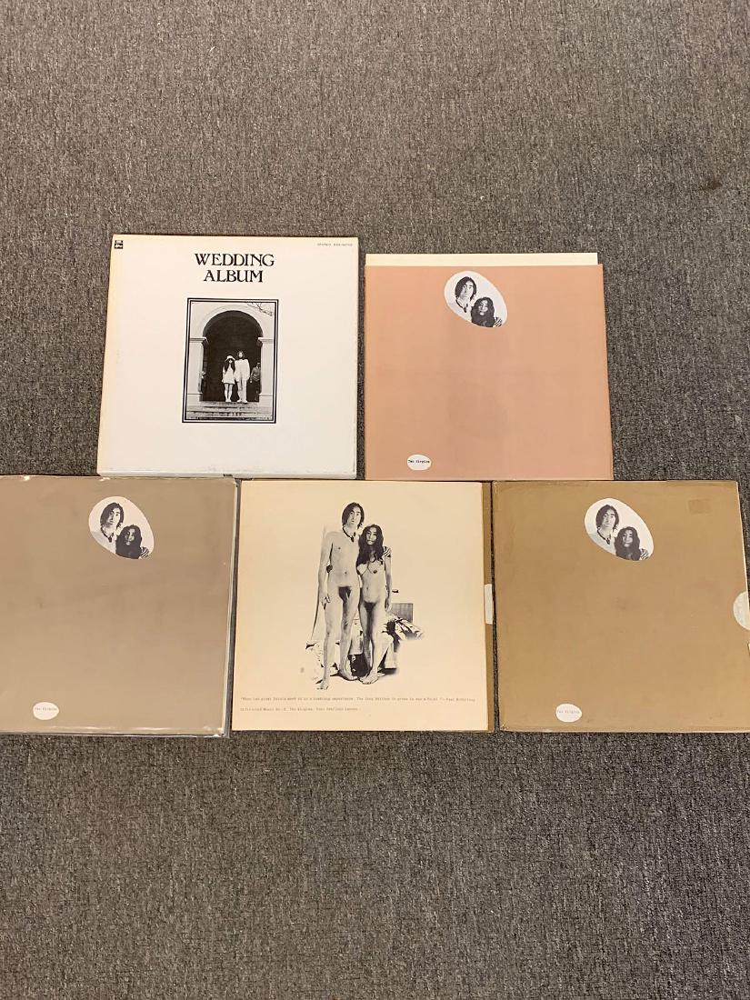 Five John Lennon/Yoko Ono LPs: A grouping of five John Lennon/Yoko Ono LPs to include four copies of "Two Virgins" and "The Wedding Album" box set. US and foreign pressings.