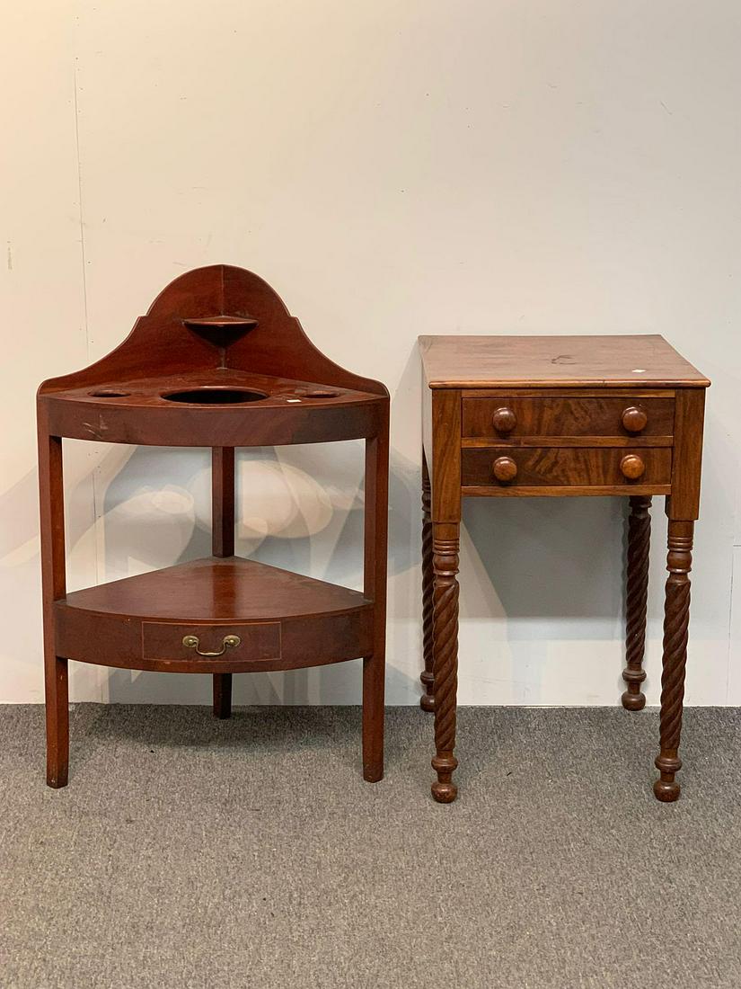 Federal Corner Washstand & Two-Drawer Stand: A Federal mahogany corner washstand with lower drawer, together with a two drawer sewing table with turned legs. Wash stand: 34 in tall x 23 in wide x 16 in deep.