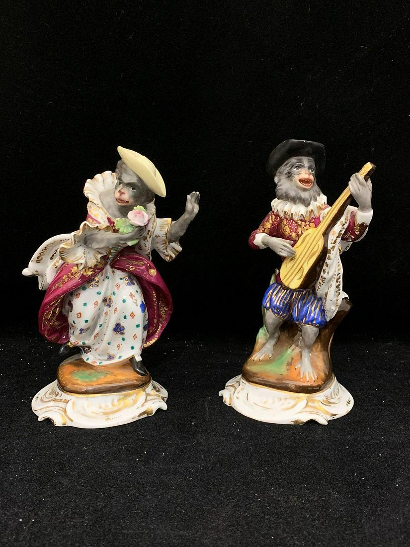 Two Continental Porcelain Monkey Band Figures: Two Continental porcelain monkey band figures to include a guitar player and a dancer. Both fitted as vases. With incised marks on base. Meissen style. Taller: 7 in.