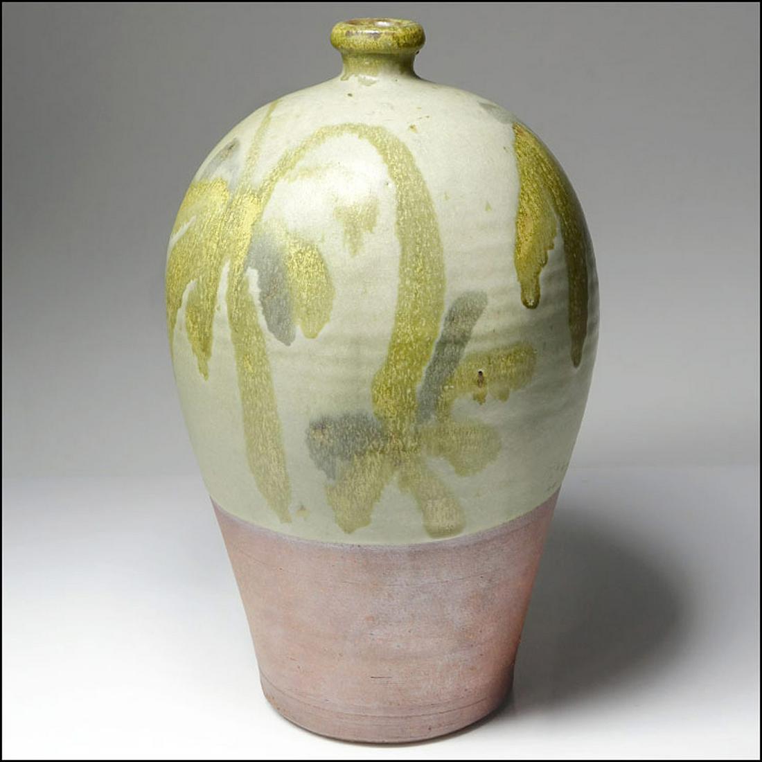 Robert Sperry Studio Pottery Vase: Robert Sperry (Washington, 1927-1998). A stoneware vase having a tall ovoid/skep form with a short neck and rounded mouth with lichen, green, and yellow glaze, applied with painterly strokes. Signed o