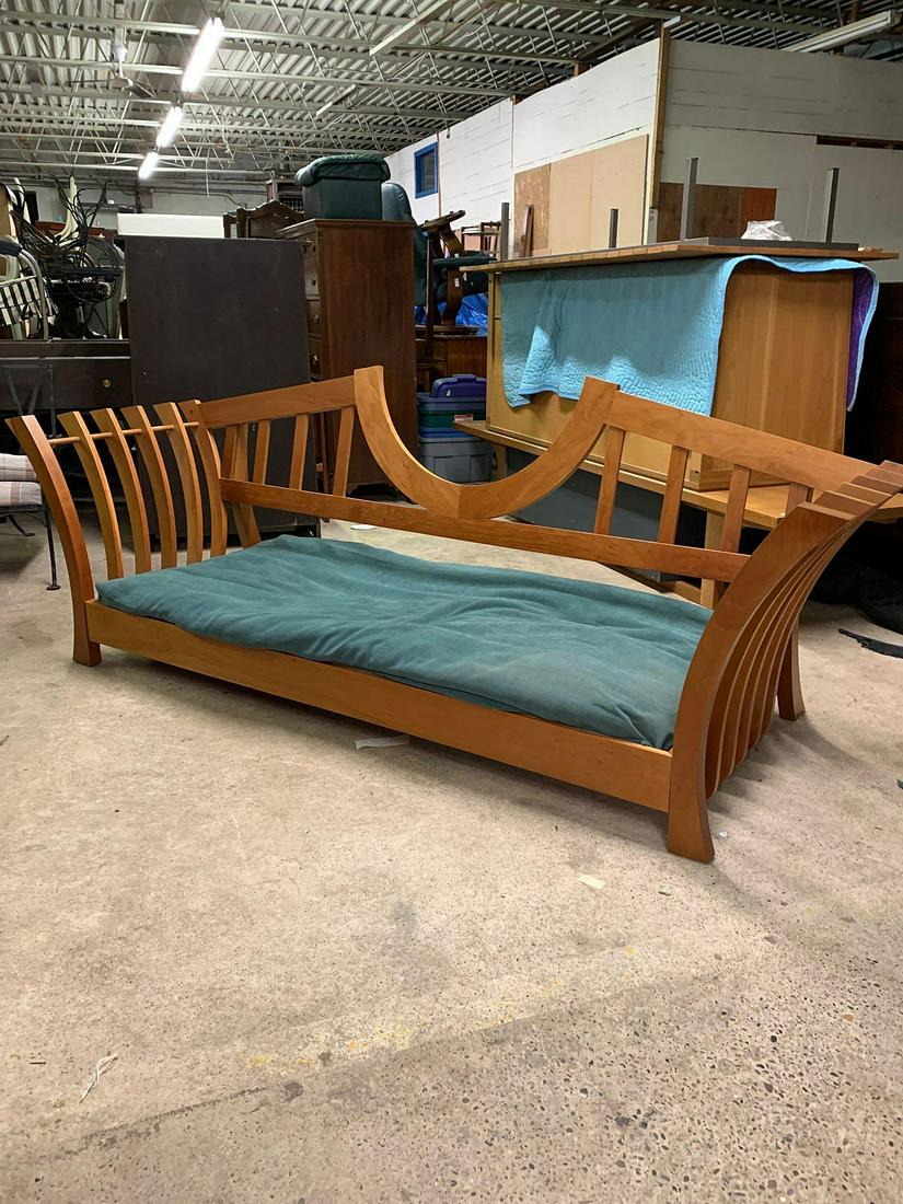 American Studio Daybed: An American Studio crafted daybed, unsigned, with green and red cushions. 30-1/2 in tall x 99 in wide x 37 in deep.