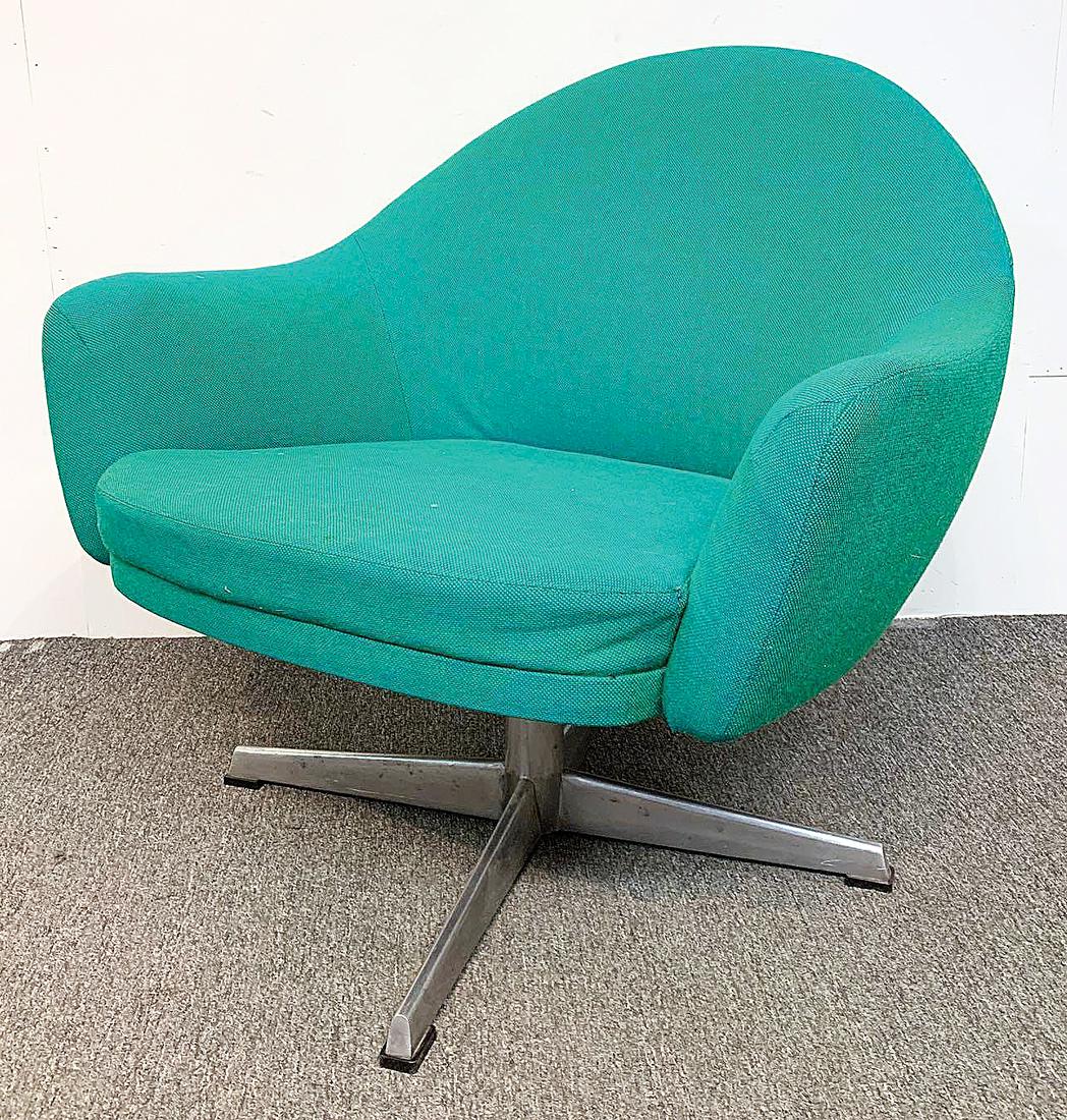 Modernist Swivel Chair: A modernist swivel chair with metal base and turquoise-green upholstery. Unmarked. Retailed by George Tanier, circa 1967. 29in tall x 29-1/2in wide x 25in deep. Provenance: The Adelman Estate Collecti