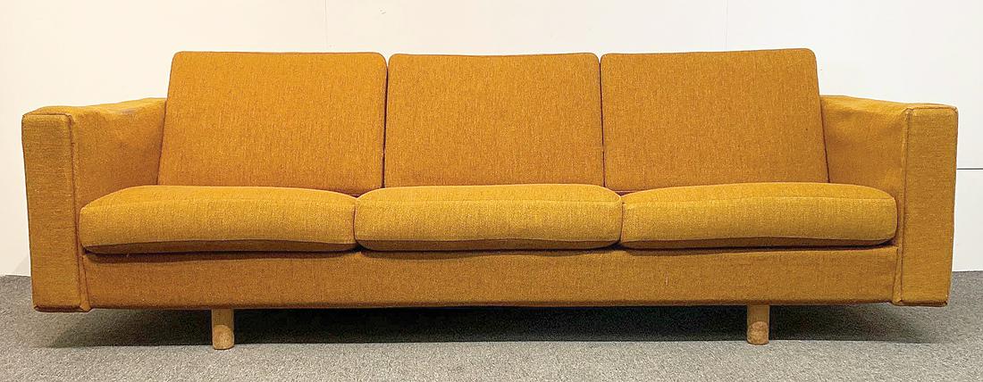 Hans Wegner GE-300 Sofa: A Hans Wegner for Getama GE-300 three-seater sofa in Trekroner 3-B orange fabric with oak legs. Branded mark. Denmark, circa 1966. Copy of receipt provided. Provenance: The Adelman Estate Collection,