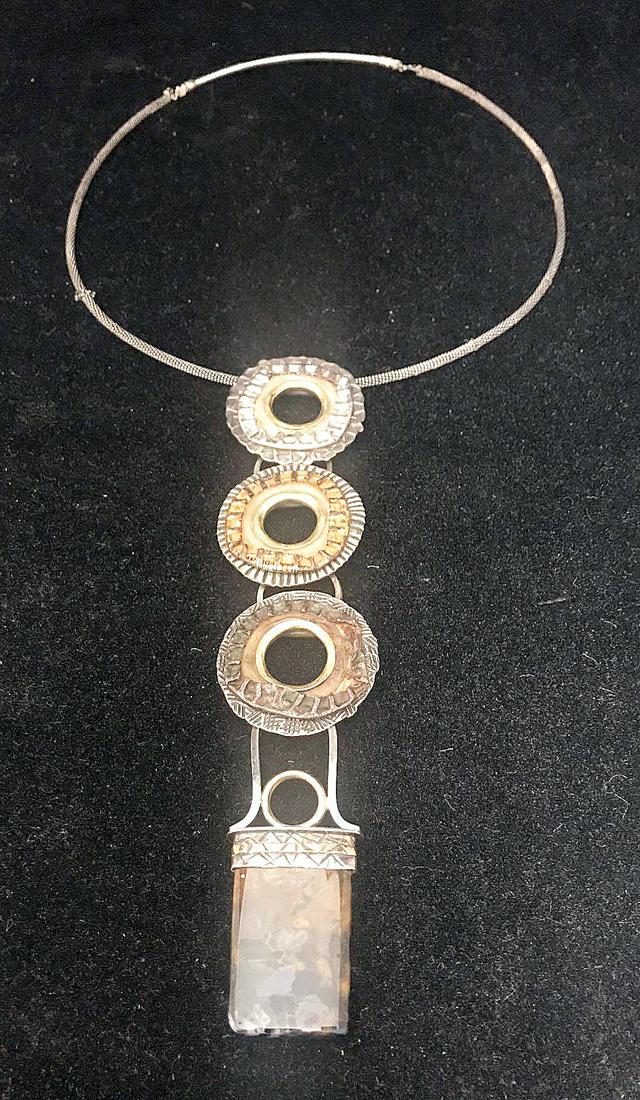 Caryn L. Hetherston. Necklace And Pin: A grouping of two pieces of Caryn L. Hetherston hand-crafted jewelry to include a sterling necklace with 22- and 14-karat gold, distressed bottle caps and petersite stone; together with a sterling pin