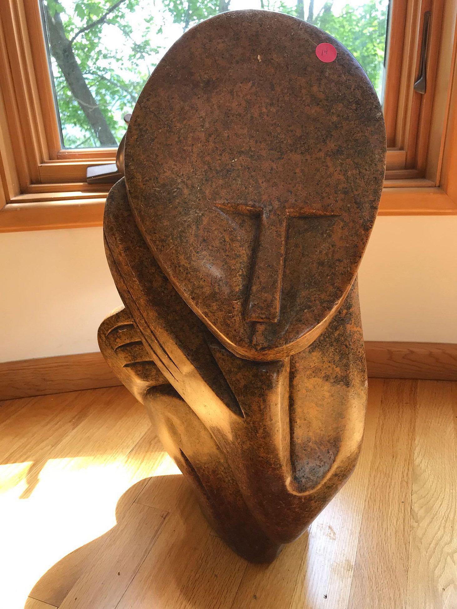 Zachariah Njobo. Shona Stone Sculpture, Elder: A Zachariah Njobo Zimbabwean Shona stone sculpture titled"Village Elder". 23in tall x 13in wide. Signed on back. Provenance: From the Estate of Bruce M. Herzog, Pipersville, PA.