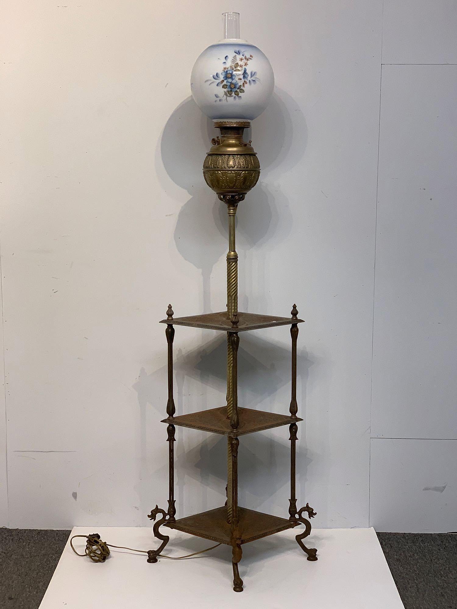Bradley & Hubbard Piano Lamp: A Bradley & Hubbard three-tiered piano lamp with griffin base and painted shade. 65in tall x 21in wide x 17in deep. Electrified.
