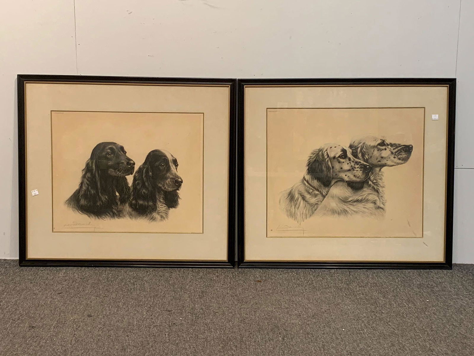 Two Leon Danchin Dog Portrait Etchings: Leon Danchin (French, 1887-1938). Two dog portrait engravings to include on of setters, the second of spaniels. Both signed in pencil lower left. In matching framed. Mat opening: 15-1/4 in x 19 in. Pr