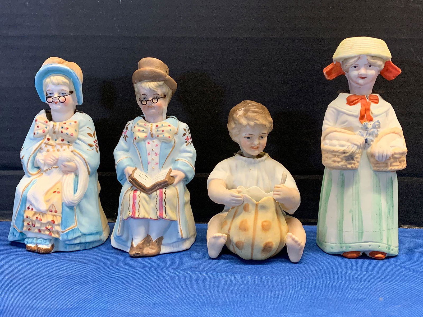 Four Porcelain Nodder Figurines (1 of 4)
