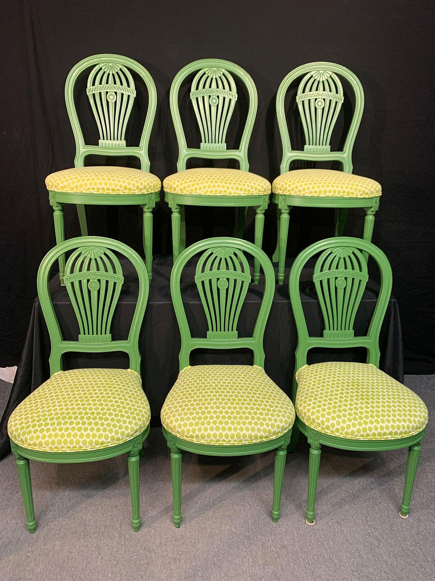 Six French Decorator Side Chairs: A set of six 20th C. French decorator side chairs, each with arched crest, reticulated balloon vertical splat, shaped seat, stretcher with carved rosette decoration, tapered fluted legs. Seats covered