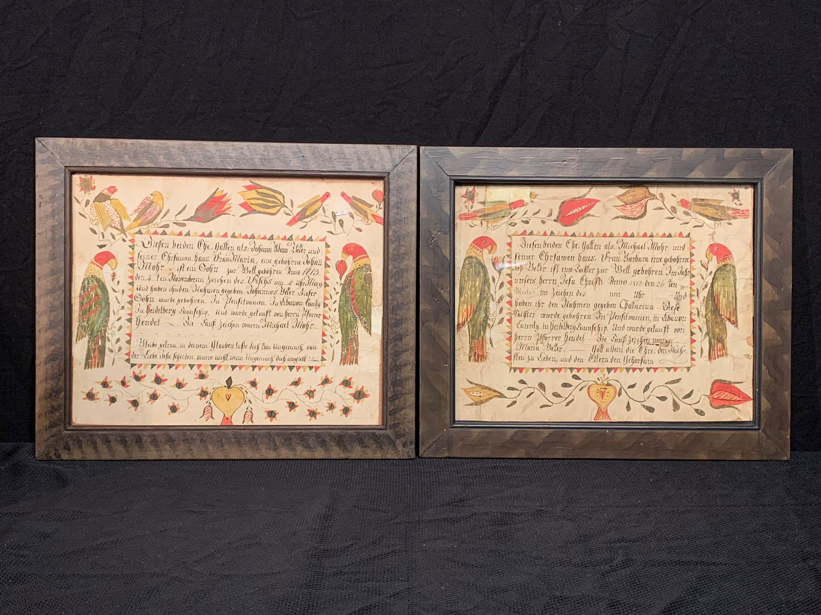 Two Lebanon County Watercolor & Ink Frakturs: A pair of Lebanon County, Pennsylvania watercolor and ink frakturs, dated 1812 and 1813 with bird and floral decoration. Both framed under glass. Frame openings: approx. 12in x 15in.