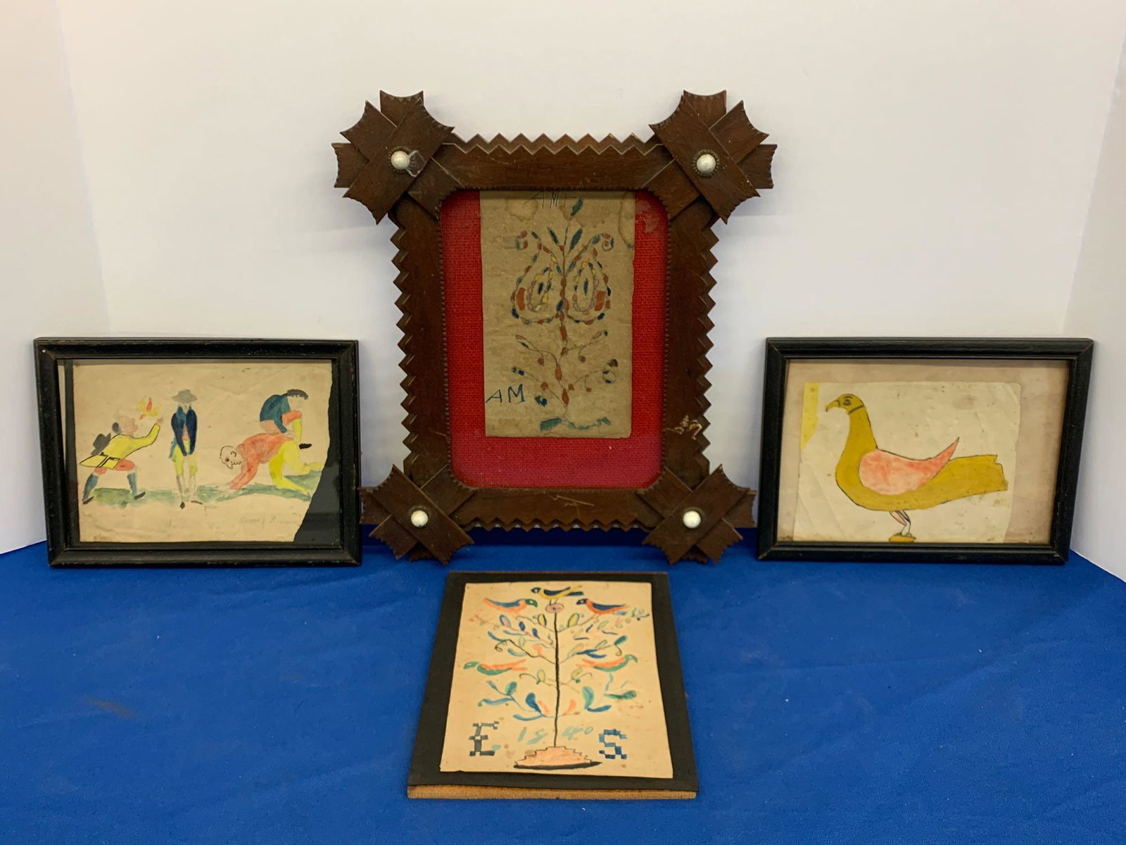 Four Ink and Watercolor Fraktur Drawings: A grouping of four 19th C. ink and watercolor fraktur drawings to include a bird; tree with birds; floral design; and a comedic figural scene. Largest frame: 11-1/2in x 10in.