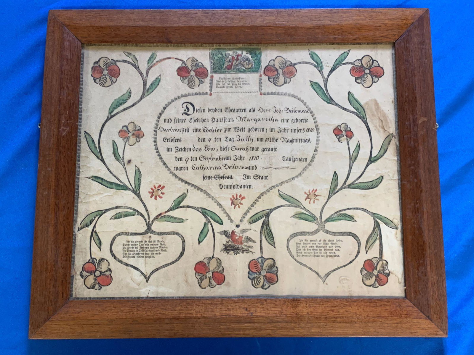1810 Pennsylvania Printed Fraktur: A Pennsylvania colored, printed Fraktur with central heart and foliate design, circa 1810. Framed under glass. Frame opening: 12-1/4in x 15-1/2in.