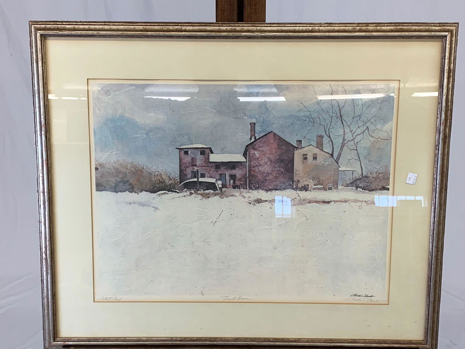 Charles Colombo. Signed Lithograph, Tenant House.: Charles Colombo (Delaware, 1927-2015). A pencil signed artist proof lithograph winter landscape titled "Tenant House". Pencil signed, titled, numbered, and framed under glass. Mat opening: 16-3/4in x