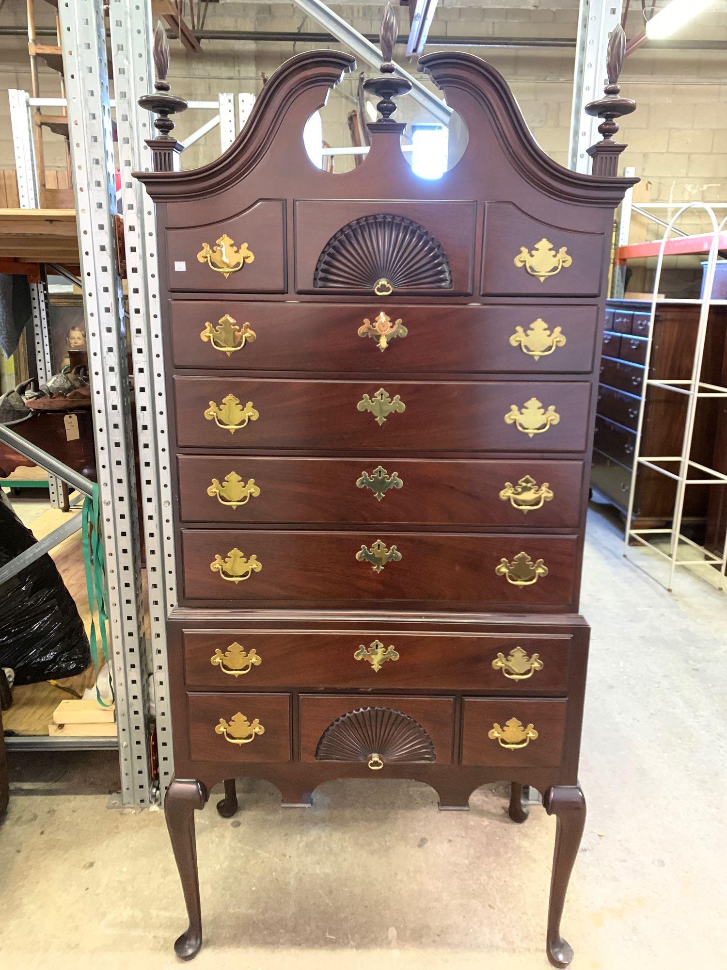 Kindel Mahogany Queen Anne-style Highboy: A contemporary Queen Anne-style mahogany highboy by Kindel, Grand Rapids, having a broken-arch pediment top over a case with central fan-carved drawers, raised on cabriole legs. Branded mark. 80in tal
